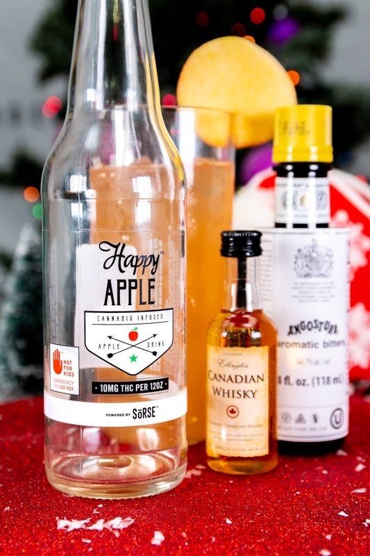 Cocktail Next to Whiskey, Bitters, and Cannabis Infused Apple Drink