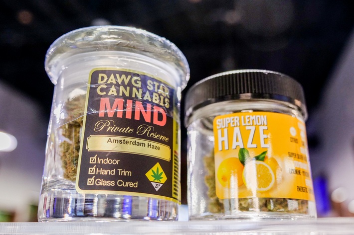 Jar of Dawg Star Cannabis Next to Jar of Super Lemon Haze Cannabis