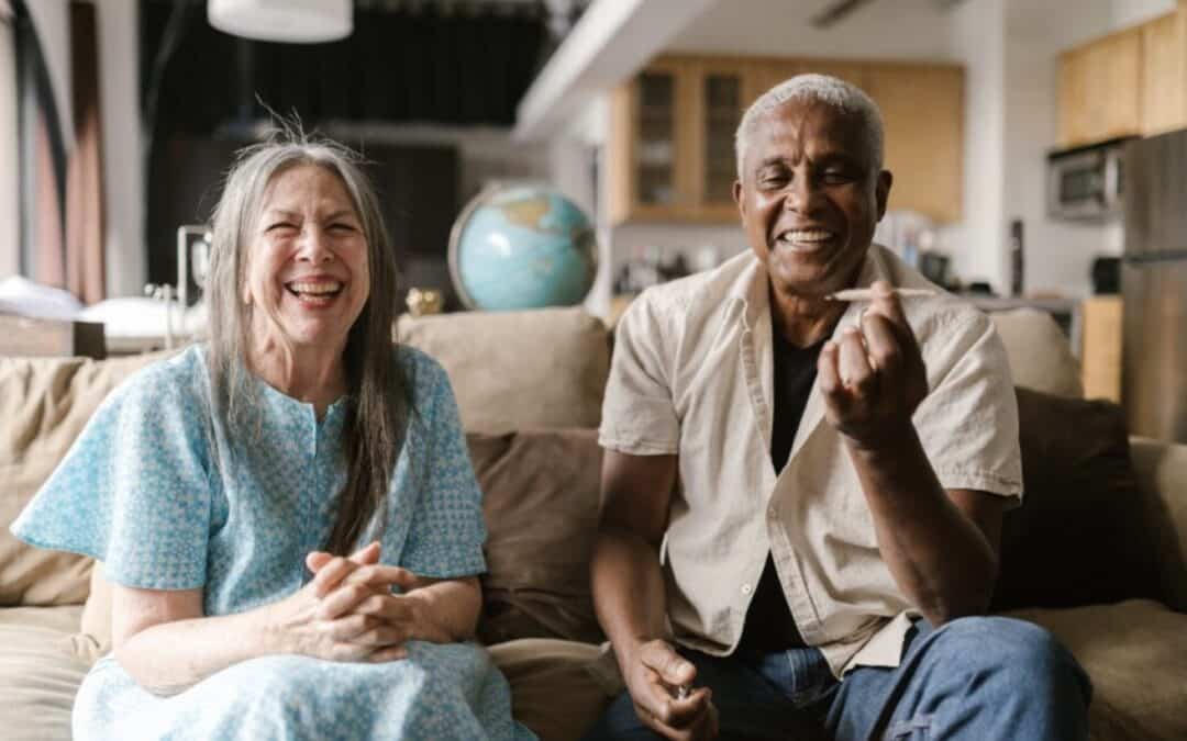 Happy Old Couple Smoking Weed on a Couch