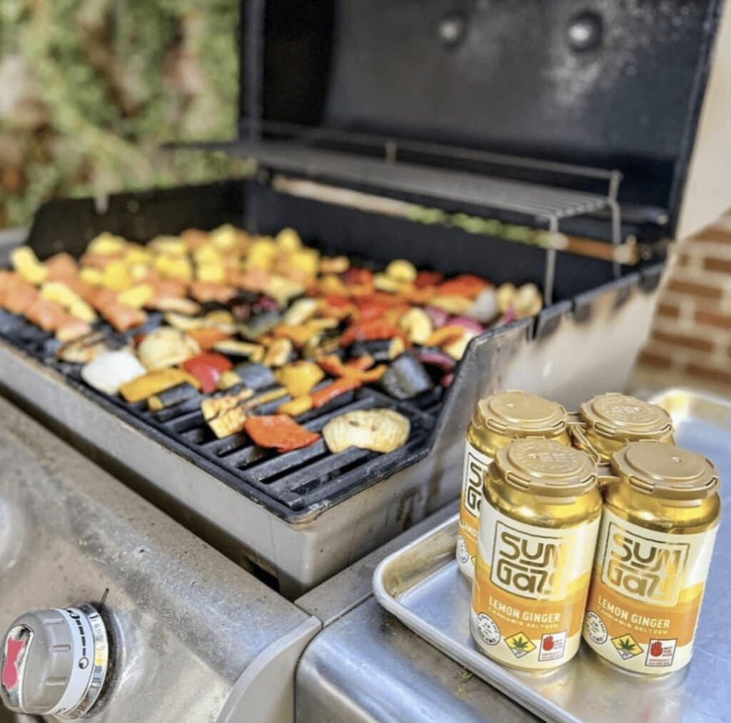 Sungaze Cannabis Infused Seltzers Next to BBQ Grill