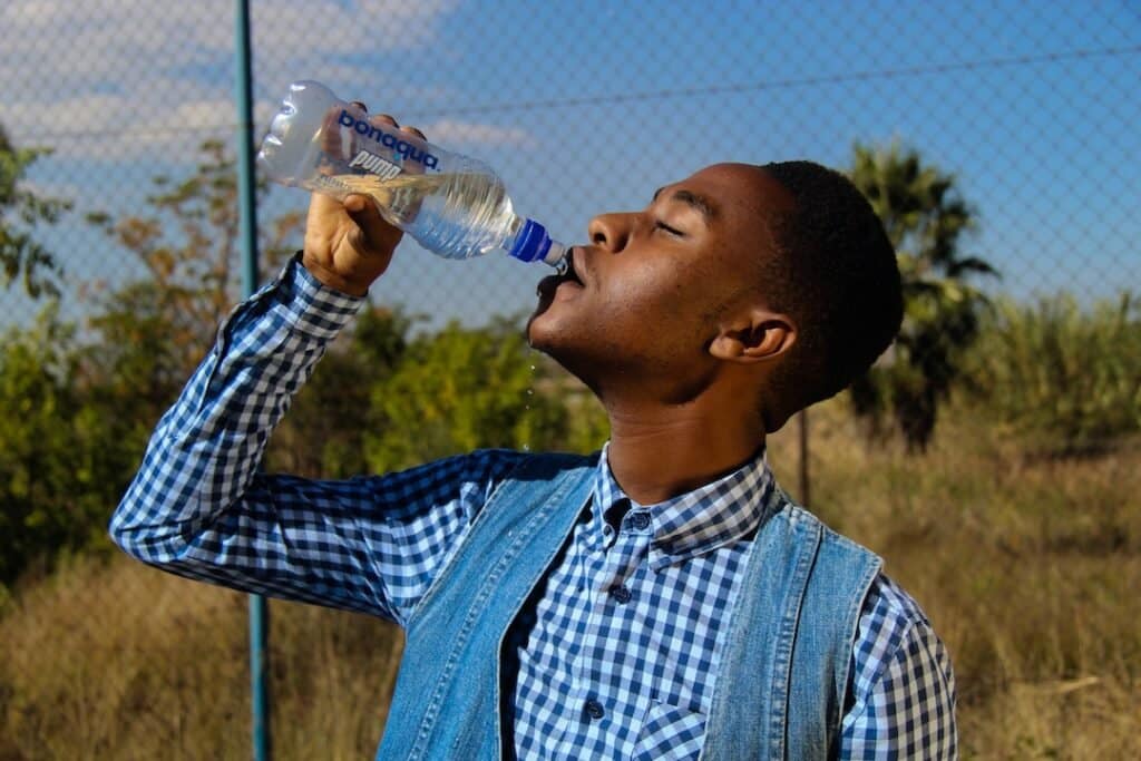 Man Drinking a Bottle of Water
