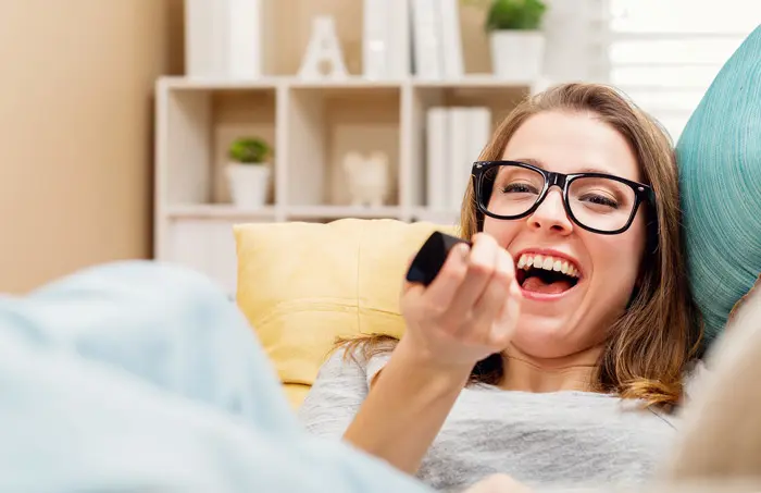 Woman Laughing at TV