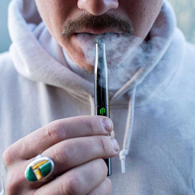 Man Dabbing Vaping Cannabis Extract Dab