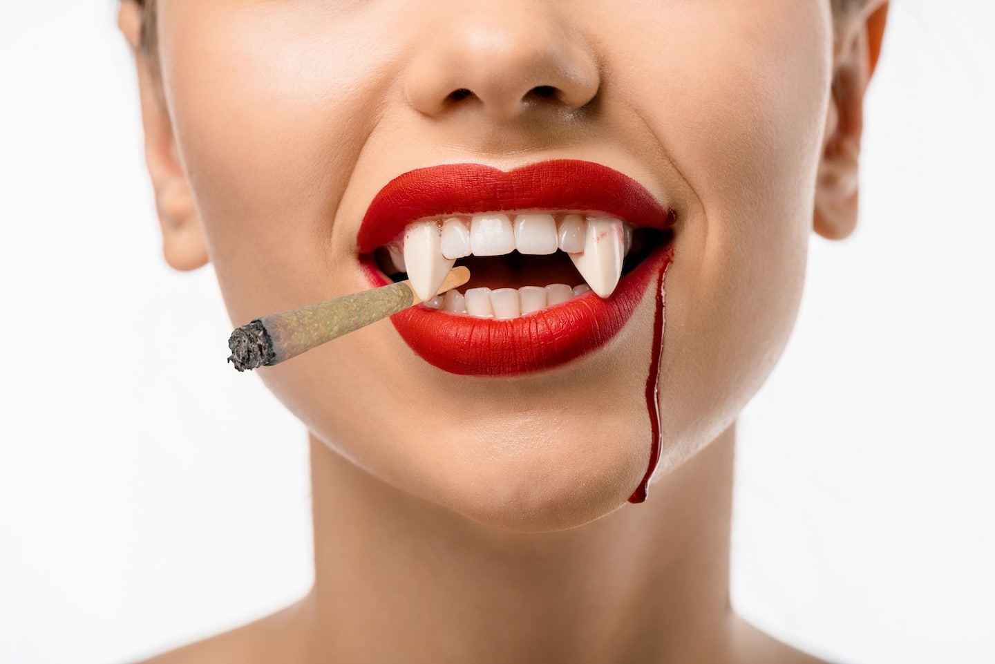 Fanged Mouth Smoking a Cannabis Joint