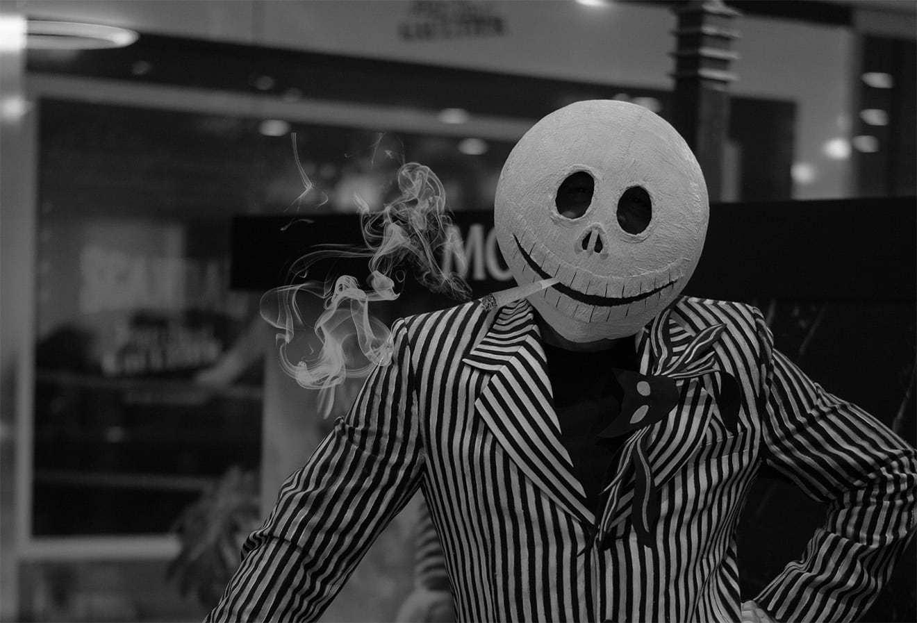 Man Dressed as a Skeleton Smoking a Joint