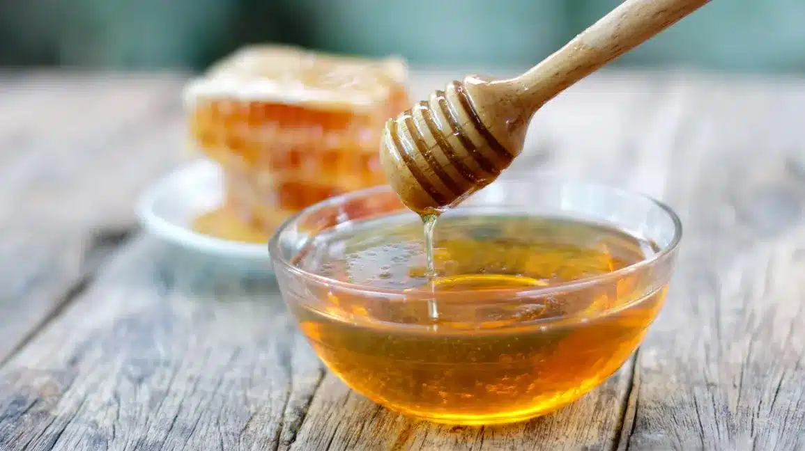 Honey in a Bowl with a Honey Wand