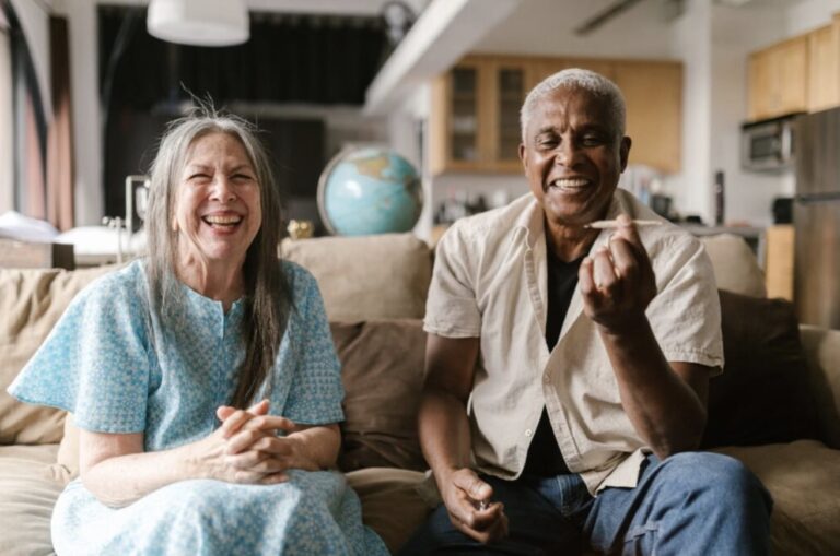 Happy Old Couple Smoking Weed on a Couch