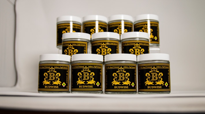 Several Jars of Budwise Cannabis Lined Up