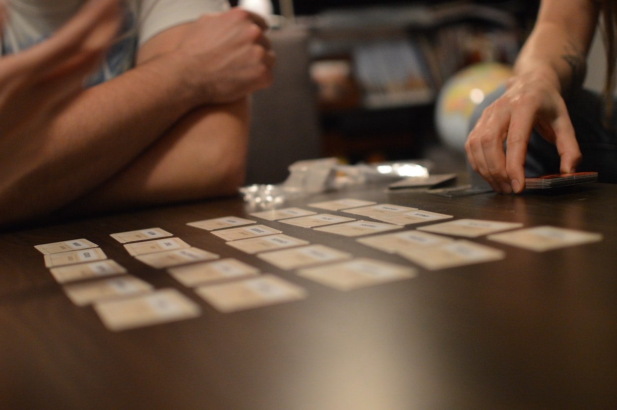 Close-up of people playing a card game