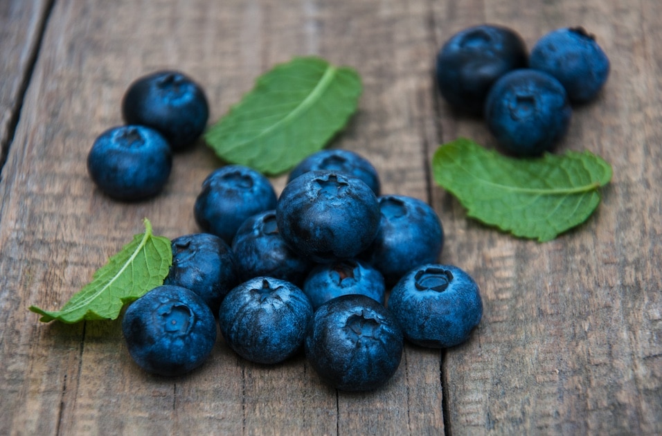 Fresh blueberries on a old wooden table