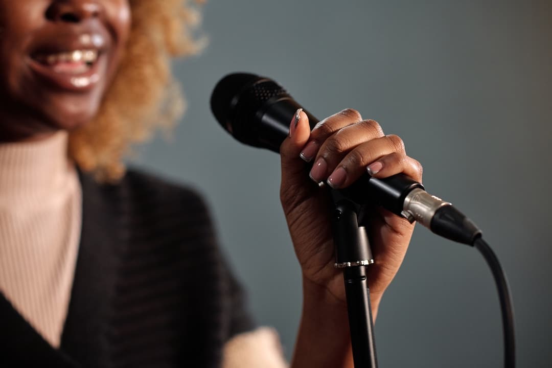 Close up of a woman singing into a microphone