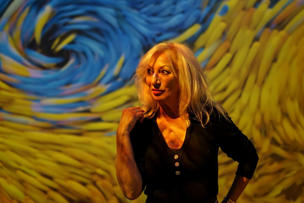 Woman in front of an art exhibit