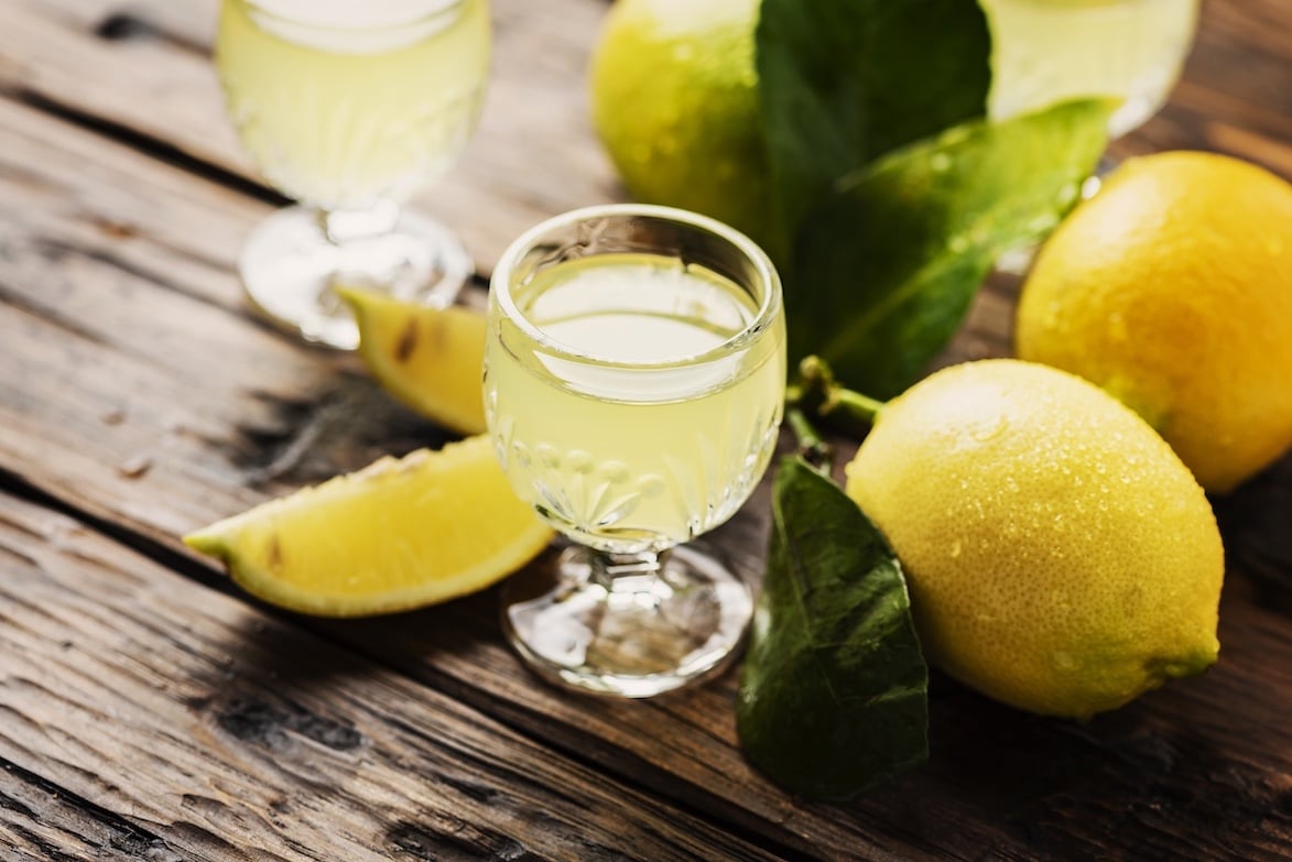 Limoncello drink surrounded by lemons