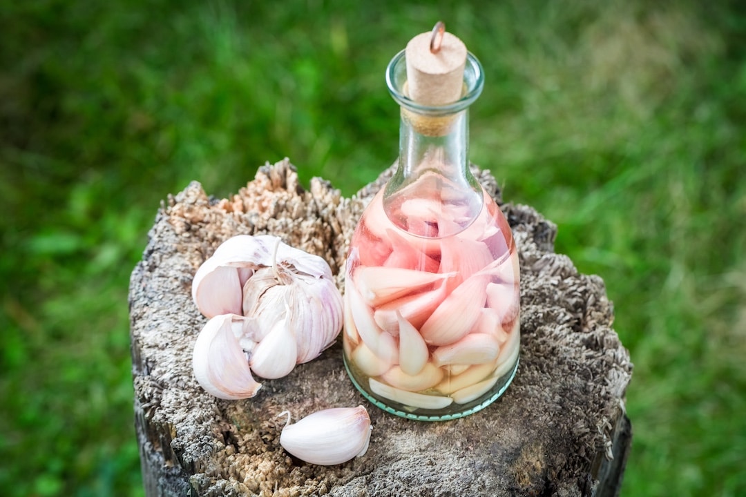 Garlic in a bottle of liquid