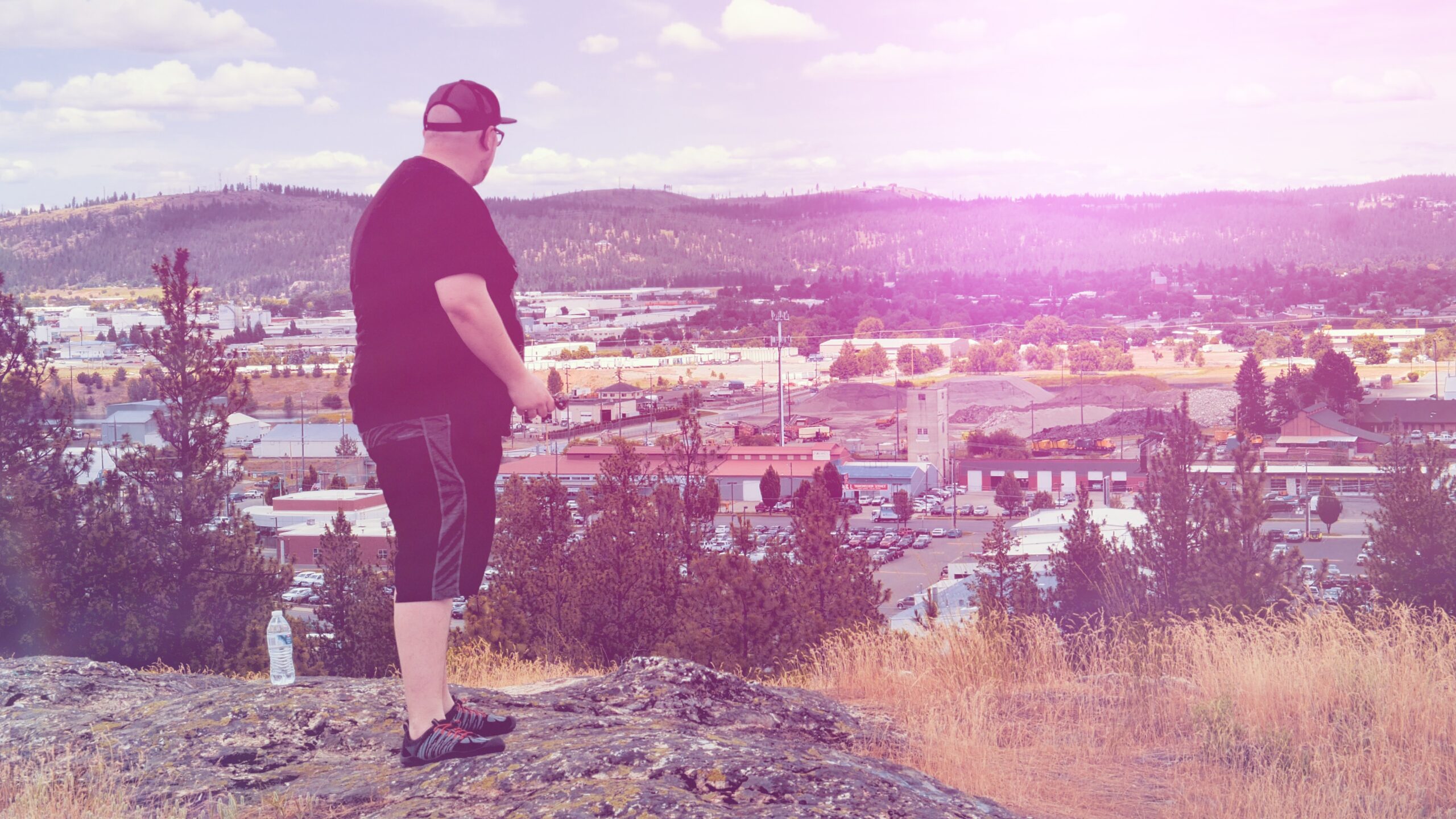 Hiking Atop A Rock - Pipe In Hand