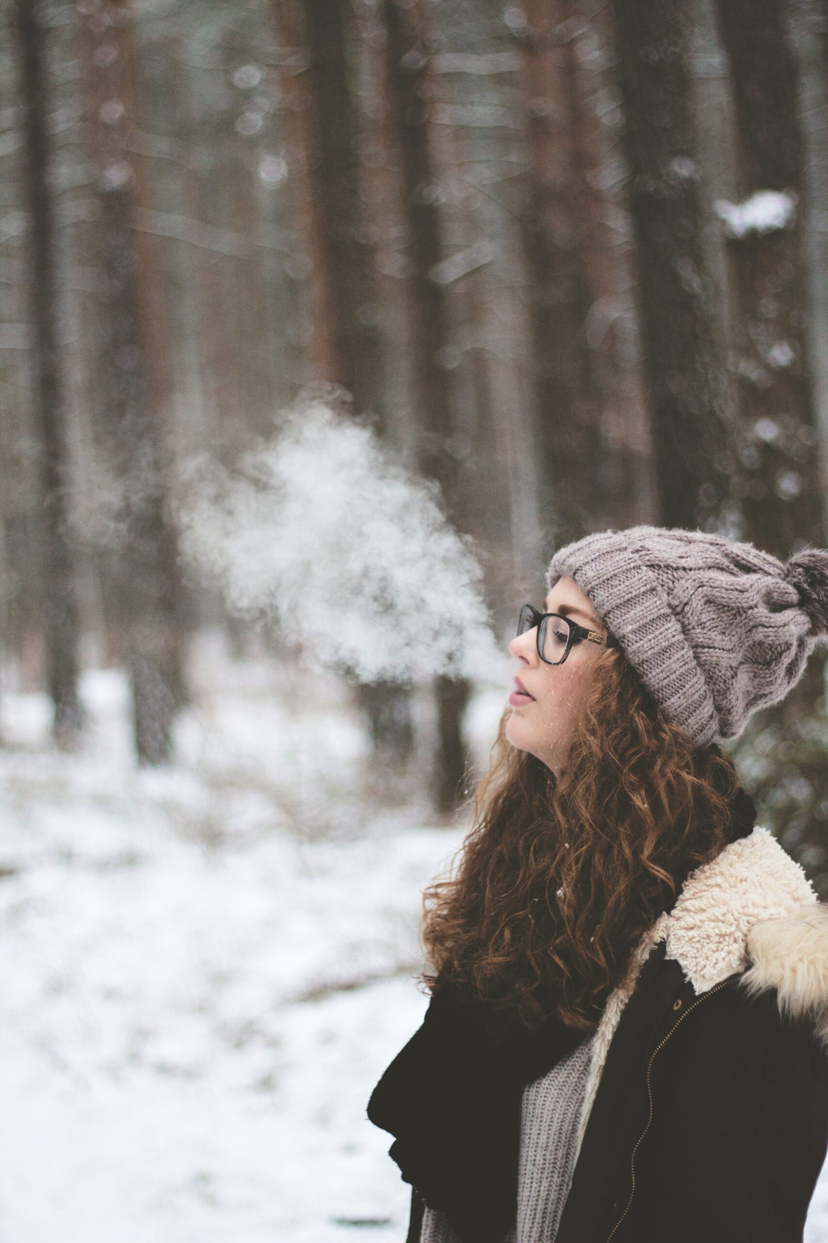Woman Smoking Outside in Winter
