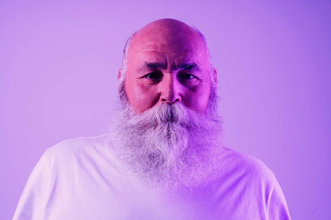 Old man in purple lighting