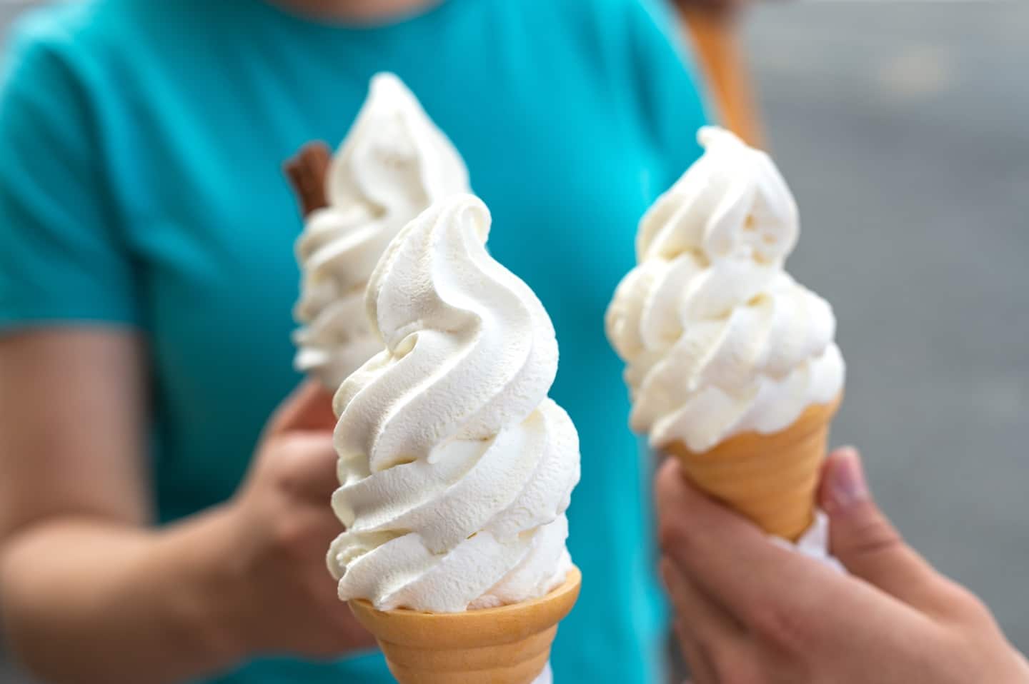 3 cones of soft serve vanilla ice cream
