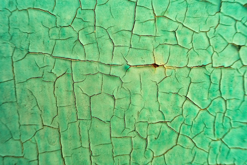 Cracked green surface to represent the cannabis strain Green Crack