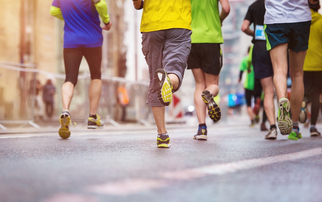 The feet of people running a marathon